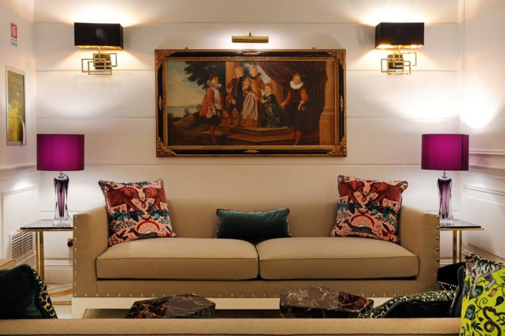 Cosy lobby with sofa bed, wall painting and lamps