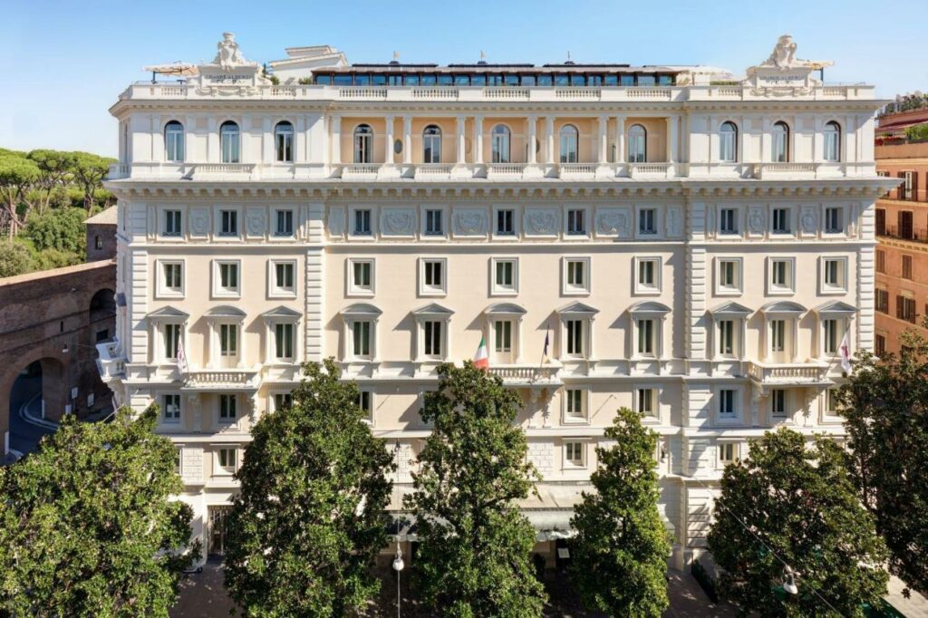 Exterior of the hotel with trees in front.